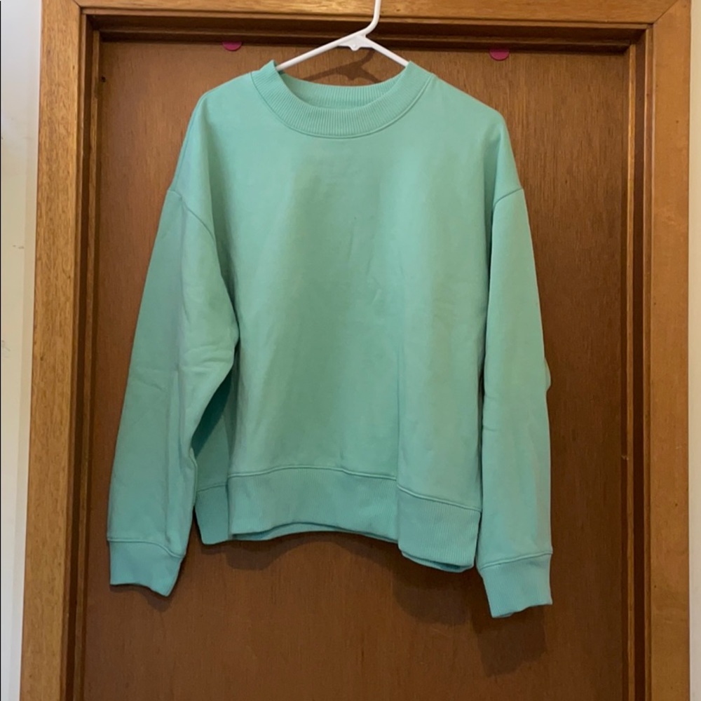 Light blue colored sweatshirt